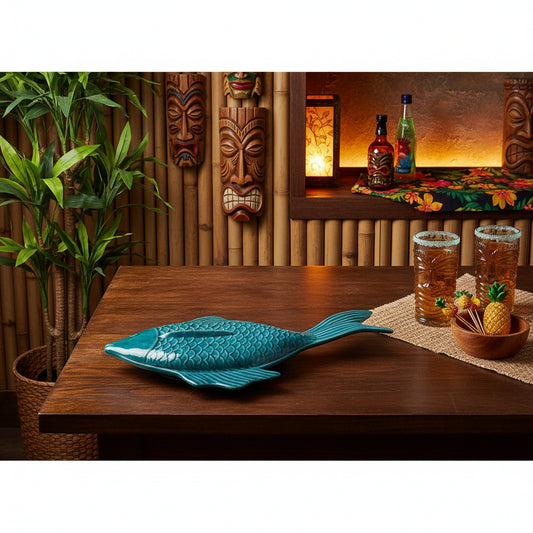 A vintage ceramic fish-shaped serving dish with a blue, turquoise, and aqua color pattern, featuring a lid.